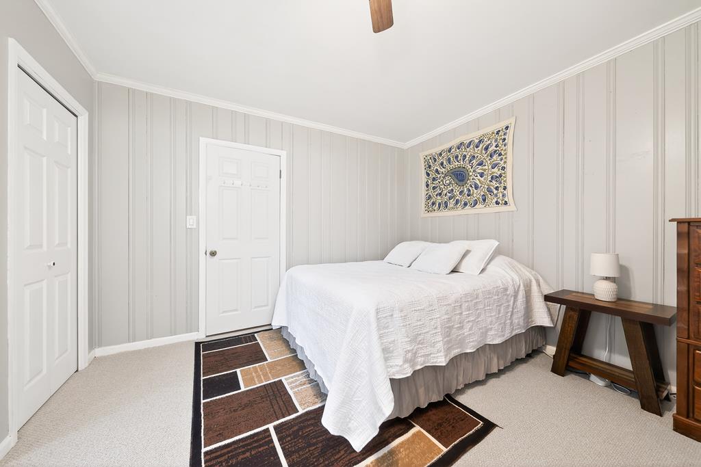 5829 Dearborn Avenue Columbus, GA 31909 - Photo 13 of 29 a bedroom with a bed and a window