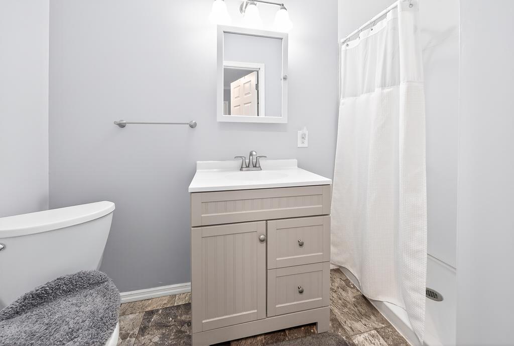 5829 Dearborn Avenue Columbus, GA 31909 - Photo 16 of 29 a bathroom with a sink toilet and vanity