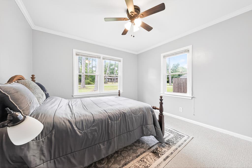 5829 Dearborn Avenue Columbus, GA 31909 - Photo 19 of 29 a bedroom with a bed and a window