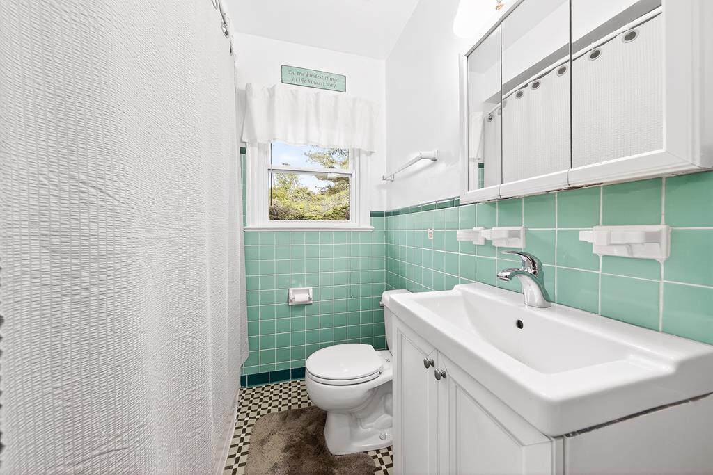 5829 Dearborn Avenue Columbus, GA 31909 - Photo 20 of 29 a bathroom with a sink a toilet and a mirror