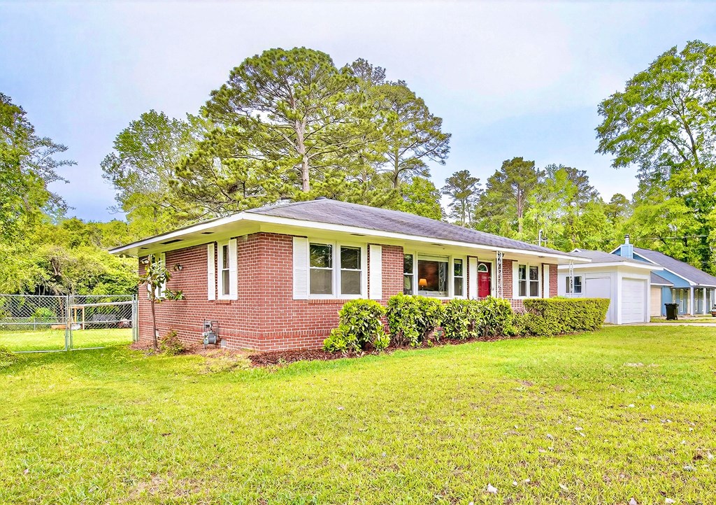 5829 Dearborn Avenue Columbus, GA 31909 - Photo 2 of 29 a front view of a house with garden