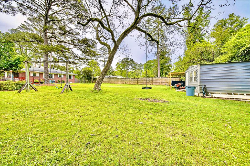 5829 Dearborn Avenue Columbus, GA 31909 - Photo 26 of 29 a huge green field with lots of trees
