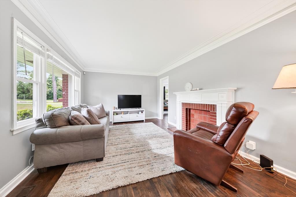 5829 Dearborn Avenue Columbus, GA 31909 - Photo 4 of 29 a living room with furniture and a flat screen tv