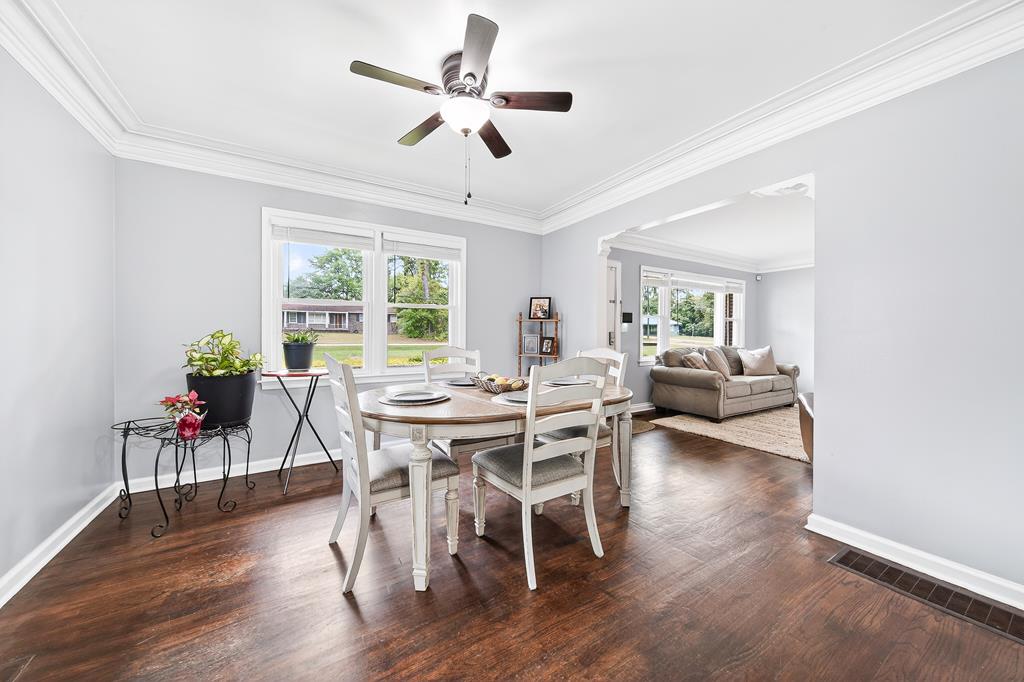 5829 Dearborn Avenue Columbus, GA 31909 - Photo 7 of 29 a view of a dining room with furniture window and wooden floor