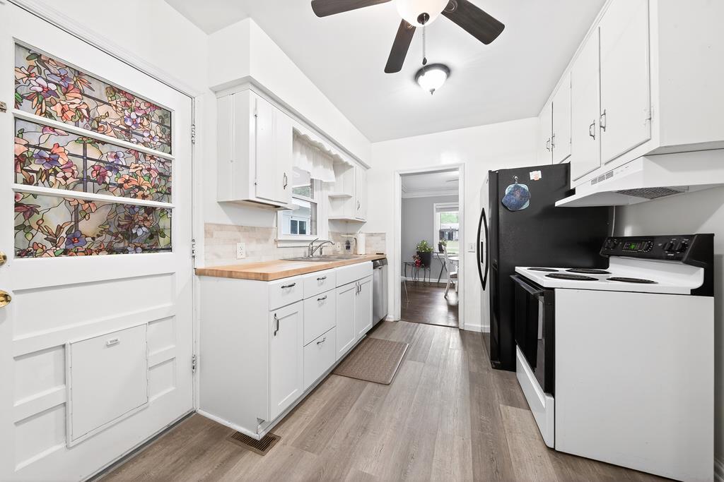 5829 Dearborn Avenue Columbus, GA 31909 - Photo 8 of 29 a kitchen with white cabinets and white appliances