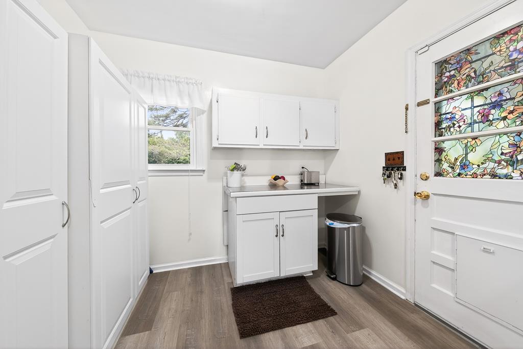 5829 Dearborn Avenue Columbus, GA 31909 - Photo 9 of 29 a room with a white cabinets and a window