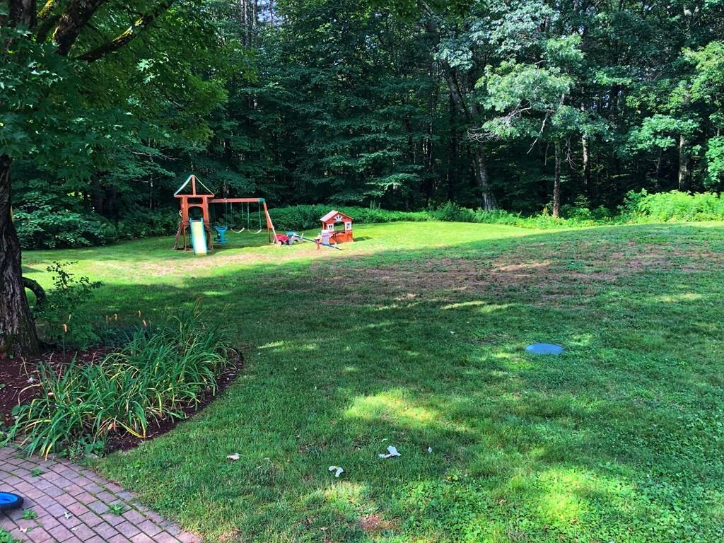 68 Barre Road Petersham, MA 01366 - Photo 18 of 25 a front view of a house with a yard and trees