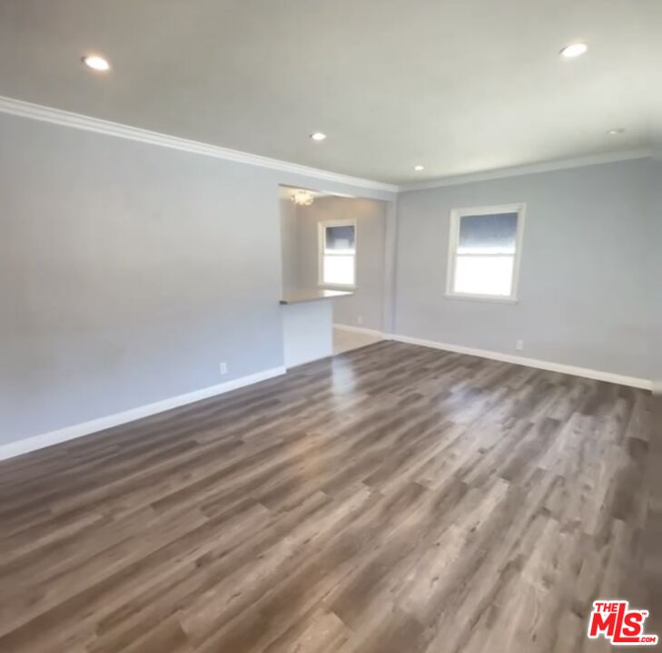 2607 Rockefeller Lane, Unit 1 Redondo Beach, CA 90278 - Photo 2 of 11 an empty room with wooden floor and windows