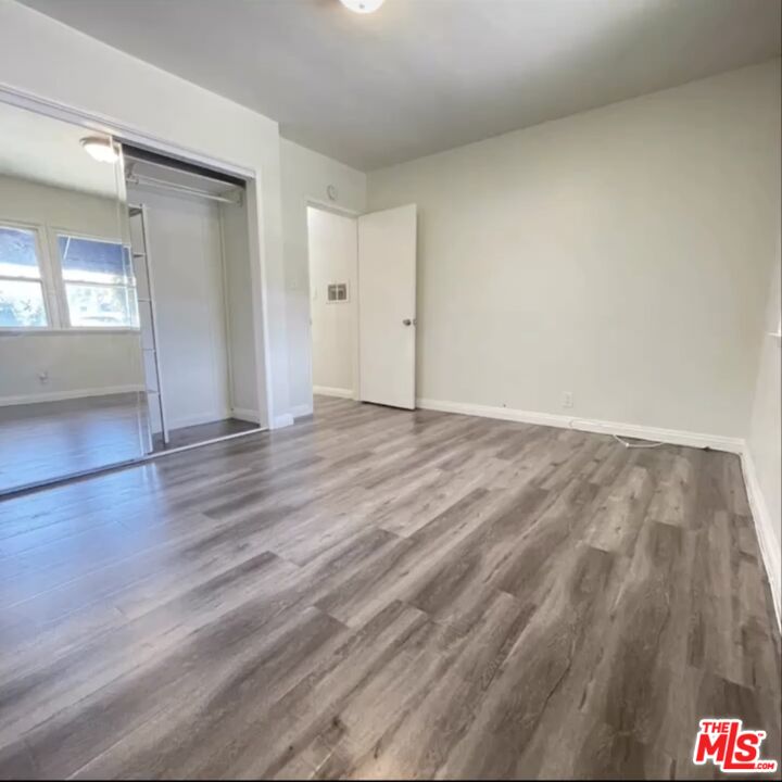 2607 Rockefeller Lane, Unit 1 Redondo Beach, CA 90278 - Photo 6 of 11 a view of an empty room and wooden floor
