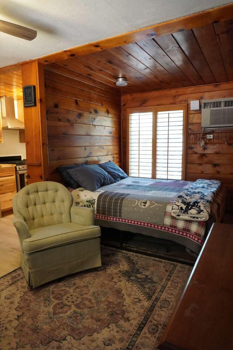 167 South Ranch Lane Payson, AZ 85541 - Photo 24 of 40 a bed sitting in a bedroom next to a window