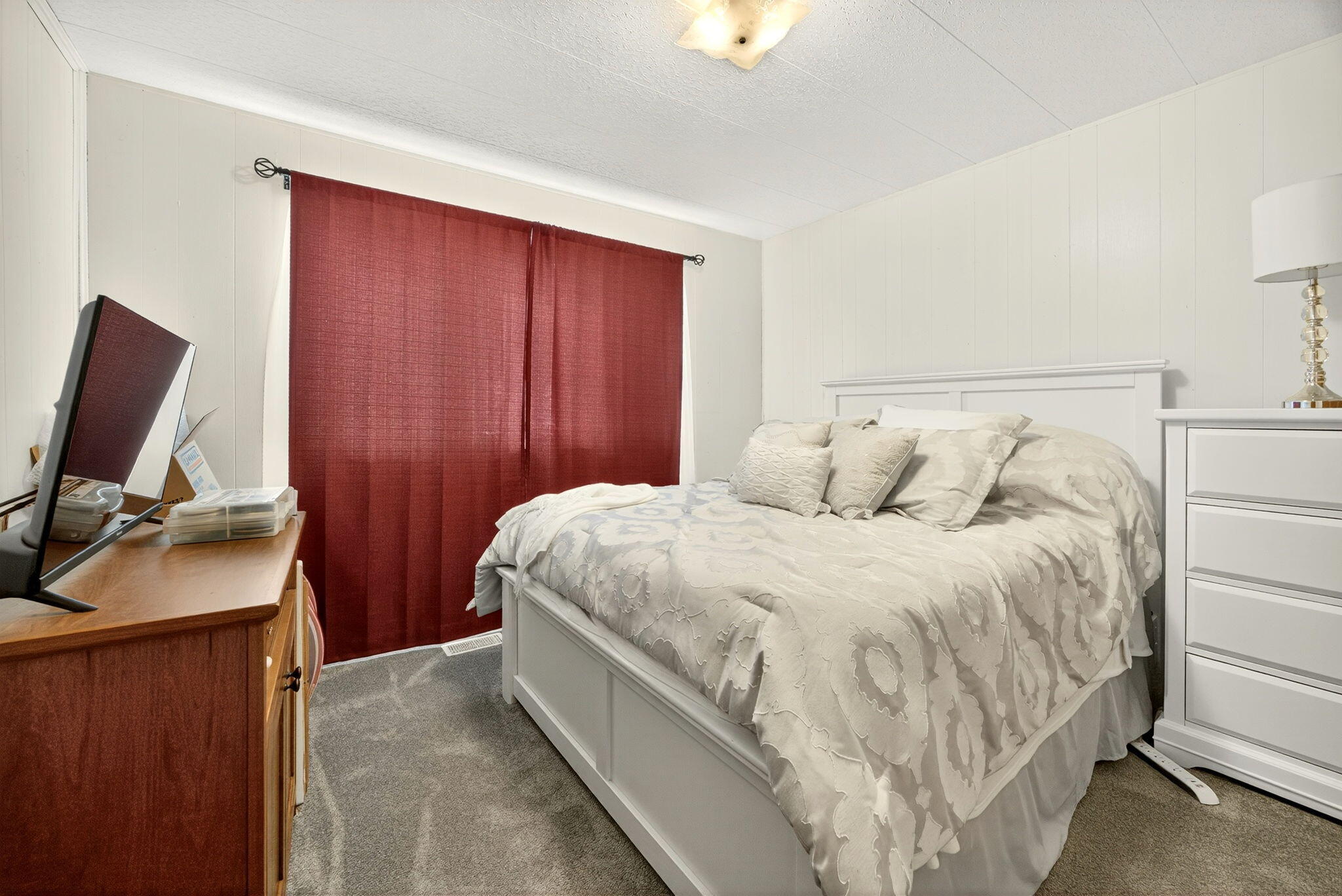 784 Meridian Road Eagle Point, OR 97524 - Photo 10 of 22 a bedroom with a bed and a flat tv screen