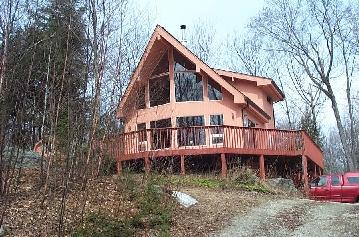 162 Dimmock Road Otis, MA 01253 - Photo 1 of 1 a view of a house with a yard