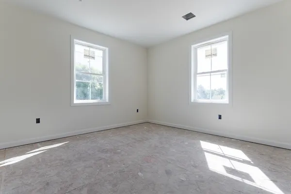 an empty room with windows
