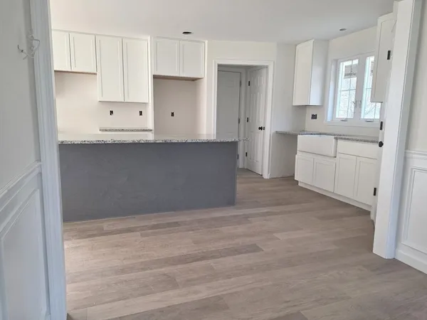 a view of kitchen with wooden floor