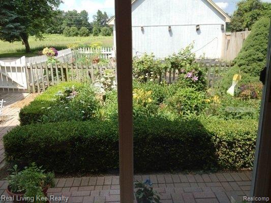 881 Brewer Road Leonard, MI 48367 - Photo 9 of 25 Sun room view.jpg