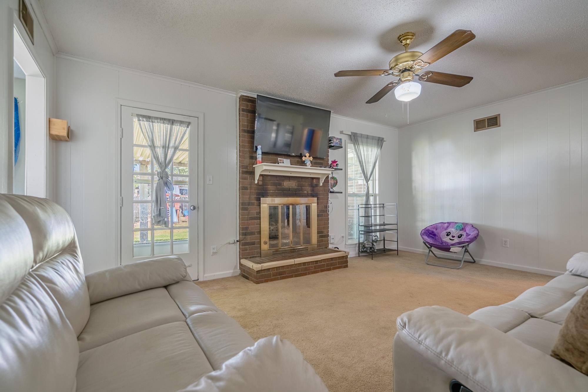 5640 Rensslaer Drive Memphis, TN 38135 - Photo 11 of 29 a bedroom with furniture and a chandelier
