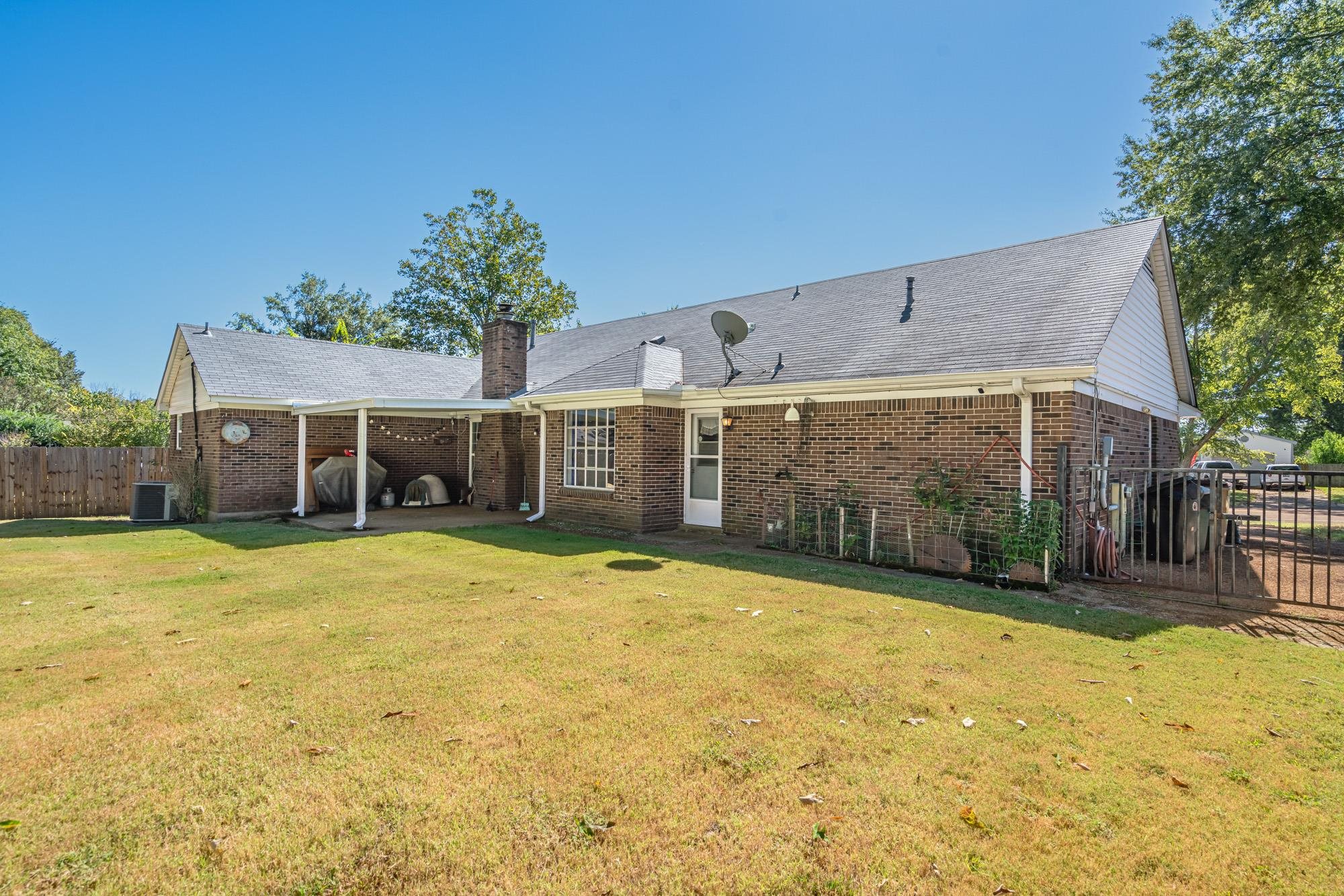 5640 Rensslaer Drive Memphis, TN 38135 - Photo 25 of 29 a front view of a house with a yard and garage