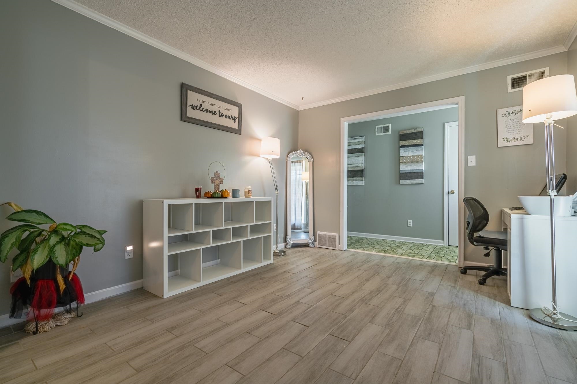 5640 Rensslaer Drive Memphis, TN 38135 - Photo 6 of 29 a view of a livingroom with furniture and a workspace