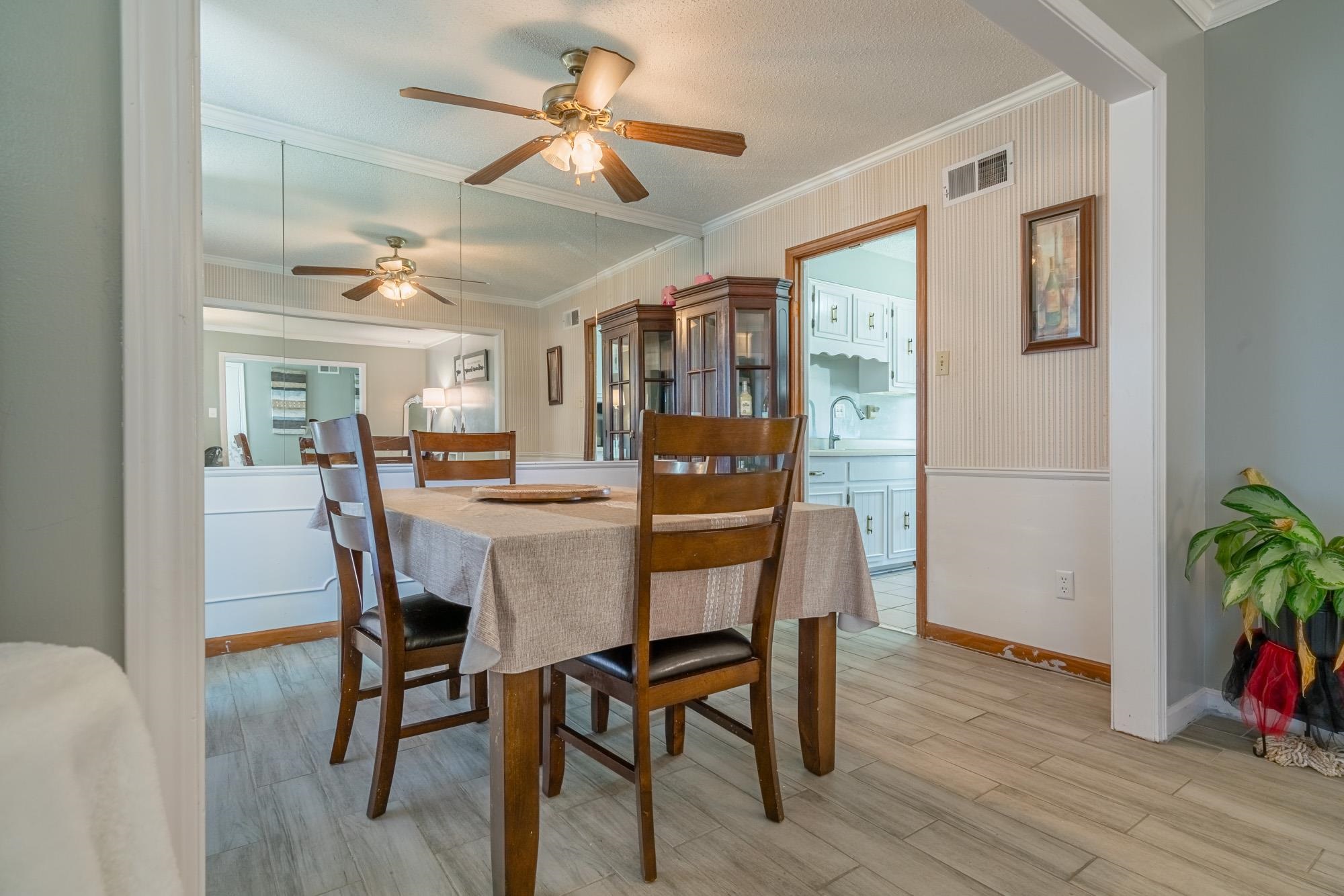 5640 Rensslaer Drive Memphis, TN 38135 - Photo 8 of 29 a view of a dining room with furniture and wooden floor