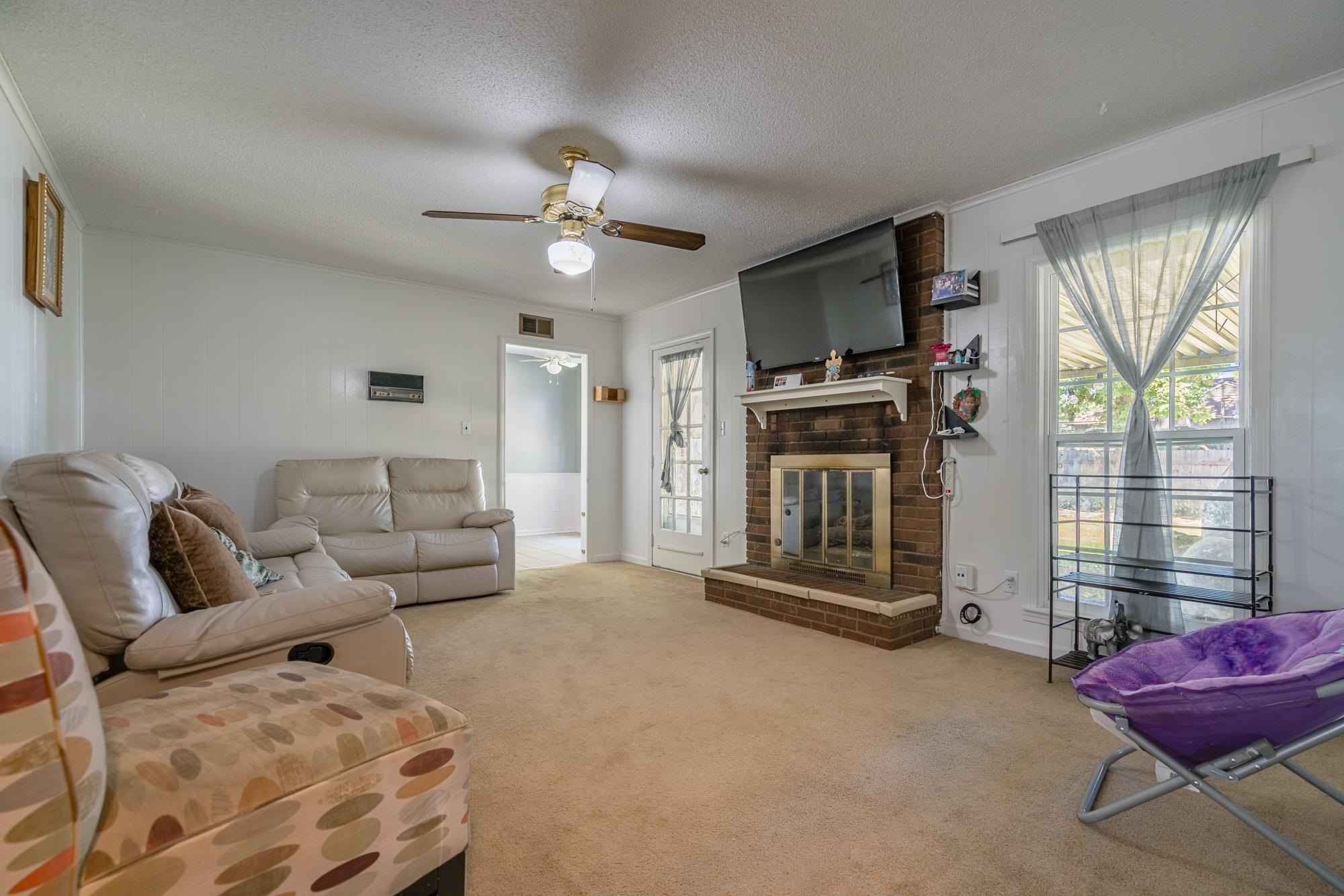 5640 Rensslaer Drive Memphis, TN 38135 - Photo 10 of 29 a living room with furniture and a flat screen tv
