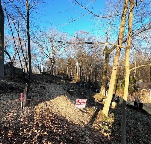 a view of yard with wooden fence