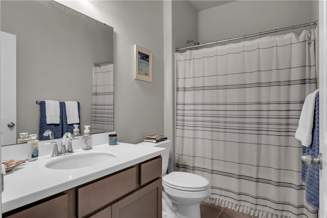 1033 Ocean Breeze Portland, TX 78374 - Photo 10 of 38 a bathroom with a sink toilet and shower