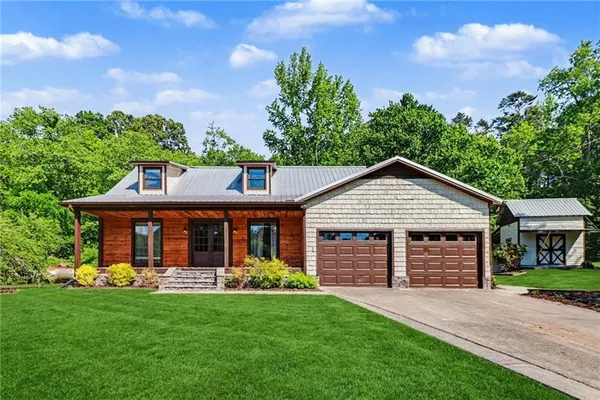 front view of a house with a yard
