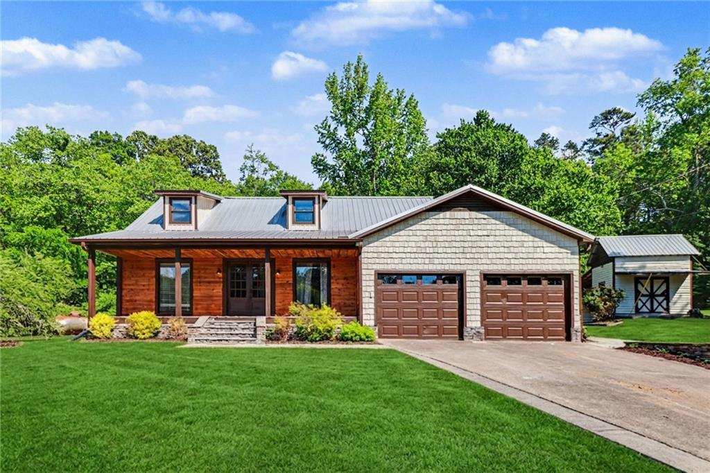 front view of a house with a yard