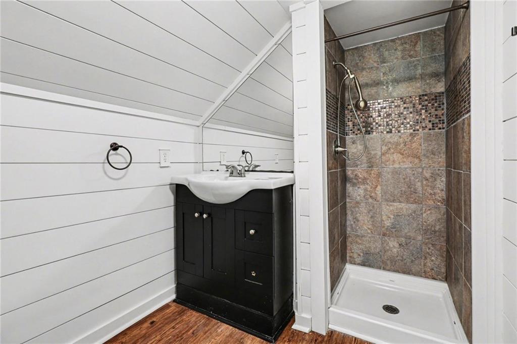 450 Big Springs Road Southeast Calhoun, GA 30701 - Photo 12 of 39 a bathroom with a sink a mirror and shower