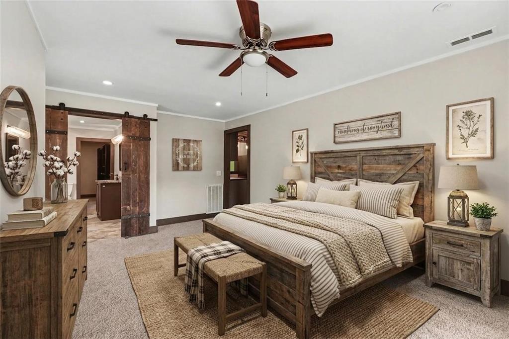 450 Big Springs Road Southeast Calhoun, GA 30701 - Photo 13 of 39 a bedroom with a bed couch and window