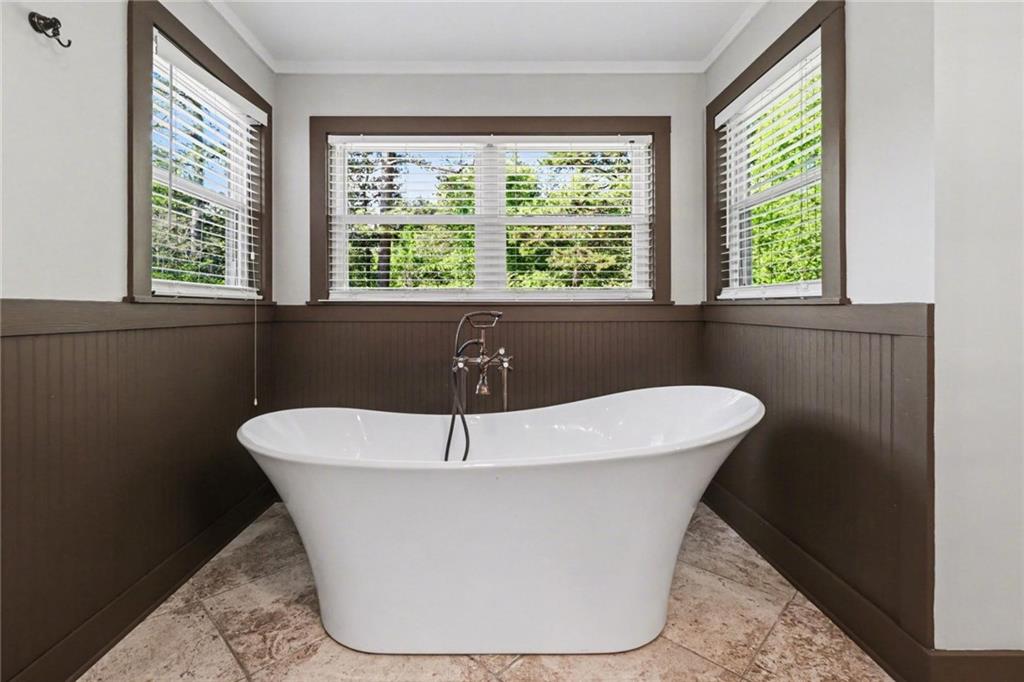 450 Big Springs Road Southeast Calhoun, GA 30701 - Photo 18 of 39 a white bath tub sitting in a bathroom next to a window