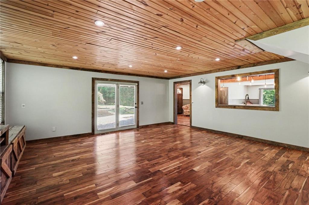 450 Big Springs Road Southeast Calhoun, GA 30701 - Photo 23 of 39 a view of an empty room with wooden floor and a window