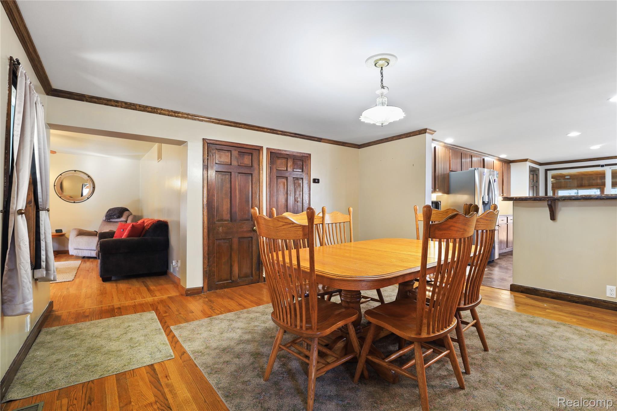 7149-7163 Burpee Road Grand Blanc, MI 48439 - Photo 64 of 72 Dining space with crown molding and light wood finished floors