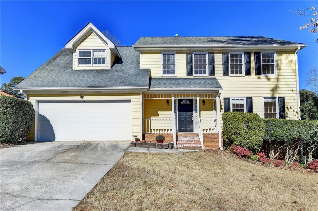 3945 Genoa Court Duluth, GA 30096 - Photo 2 of 64 a front view of a house with garden