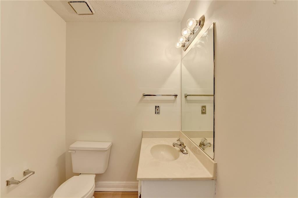 3945 Genoa Court Duluth, GA 30096 - Photo 36 of 64 a bathroom with a sink mirror and toilet