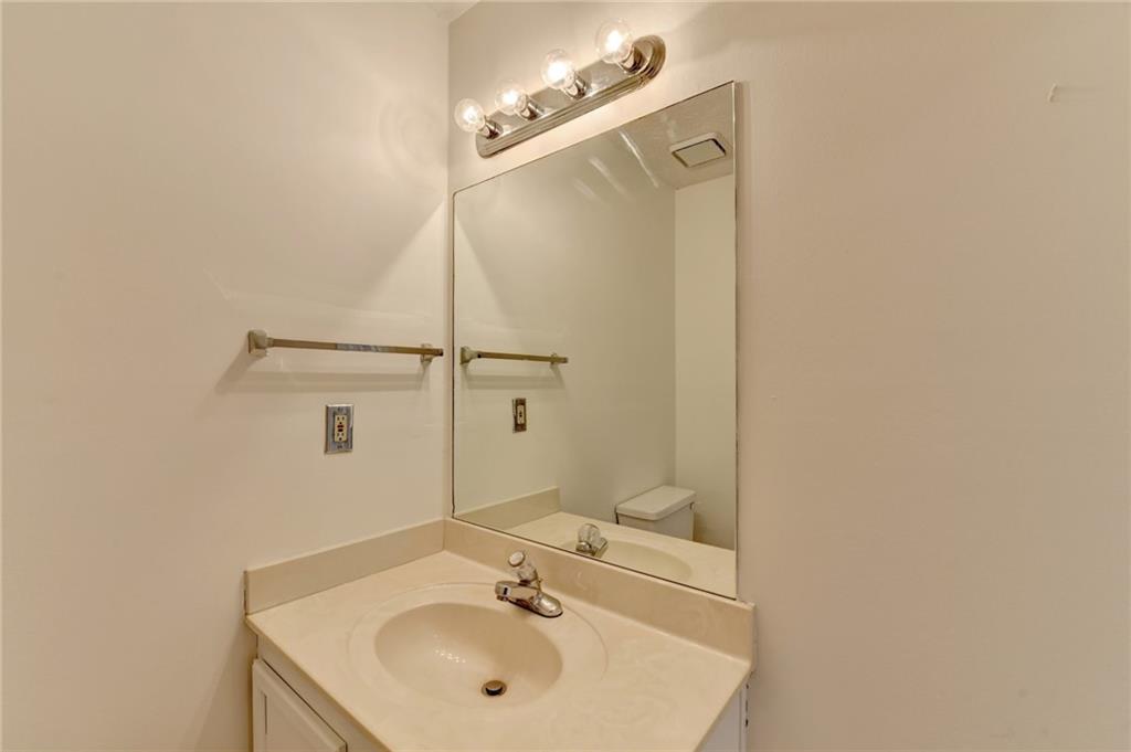 3945 Genoa Court Duluth, GA 30096 - Photo 37 of 64 a bathroom with a sink and mirror