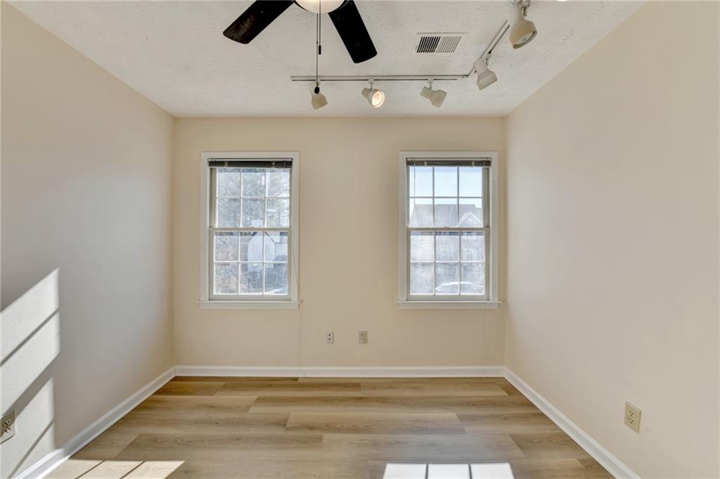 3945 Genoa Court Duluth, GA 30096 - Photo 42 of 64 an empty room with windows and fan