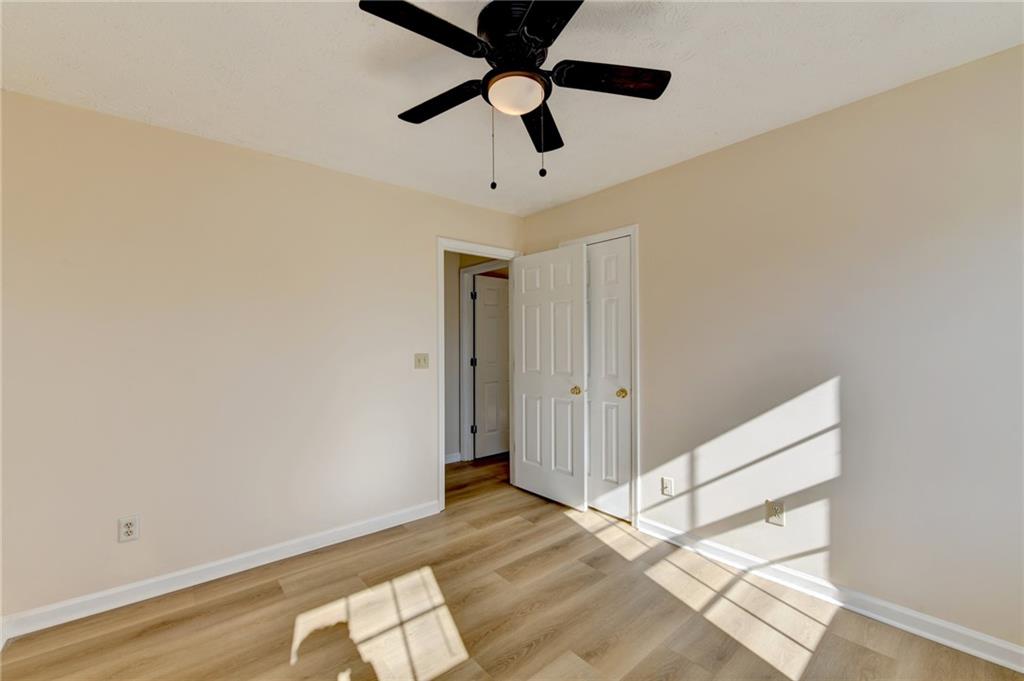 3945 Genoa Court Duluth, GA 30096 - Photo 43 of 64 a view of empty room with wooden floor