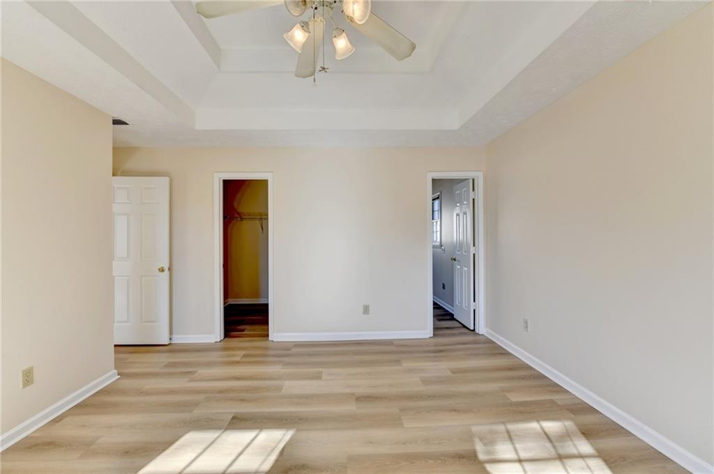 3945 Genoa Court Duluth, GA 30096 - Photo 48 of 64 a view of an empty room with wooden floor