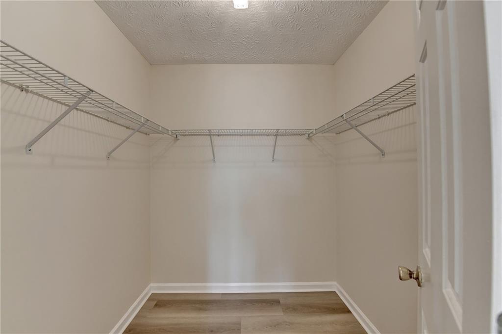 3945 Genoa Court Duluth, GA 30096 - Photo 52 of 64 a view of a room with racks on the wall