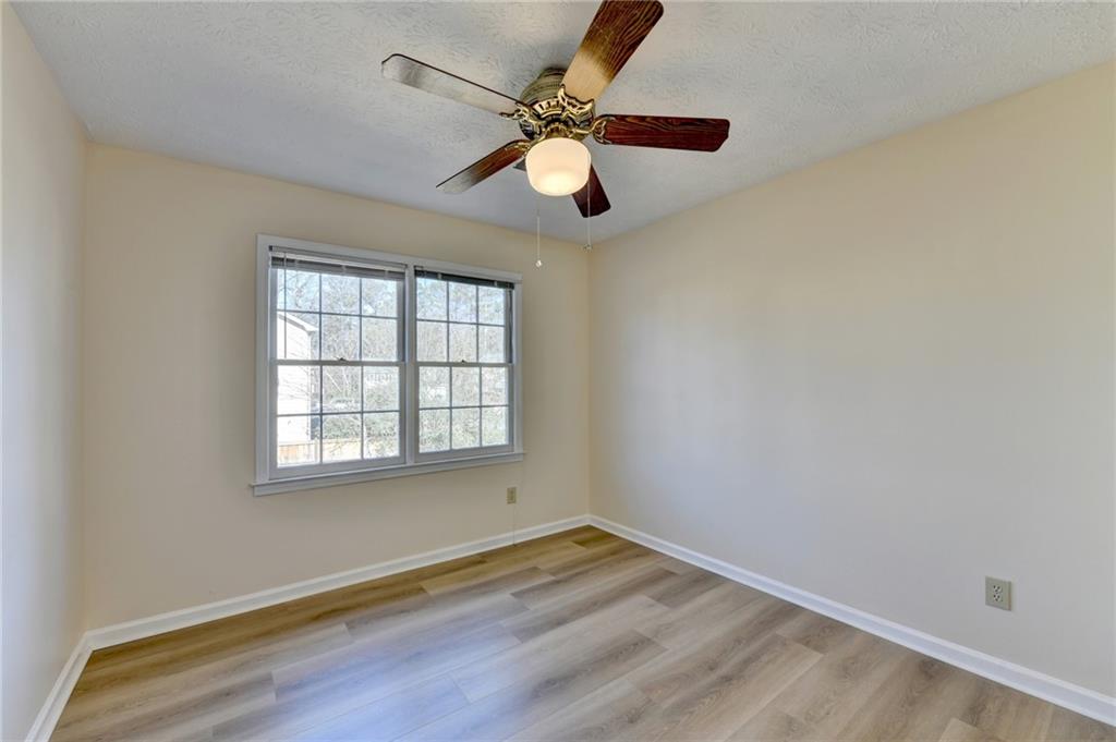 3945 Genoa Court Duluth, GA 30096 - Photo 53 of 64 wooden floor in an empty room with a window