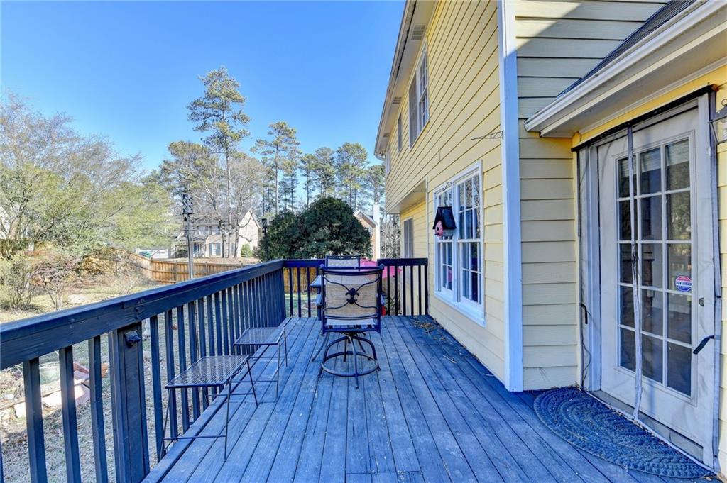3945 Genoa Court Duluth, GA 30096 - Photo 60 of 64 a balcony with wooden floor and outdoor seating