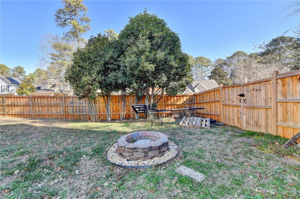 3945 Genoa Court Duluth, GA 30096 - Photo 61 of 64 a backyard of a house with table and chairs