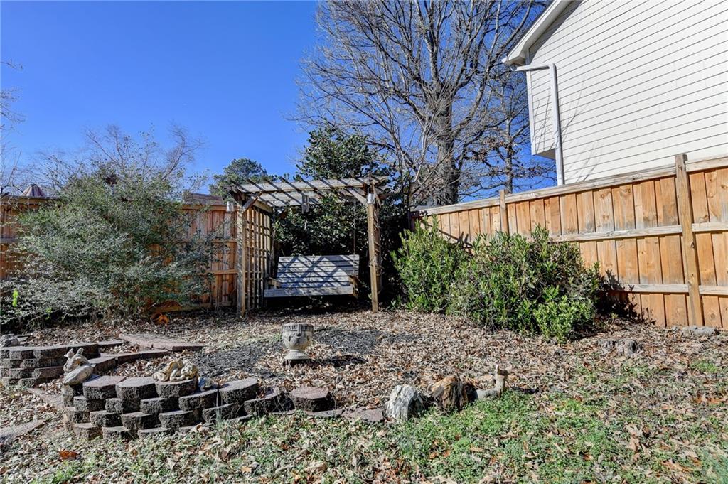 3945 Genoa Court Duluth, GA 30096 - Photo 63 of 64 a view of a backyard with plants and large trees