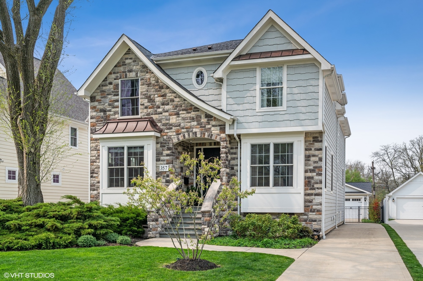 357 Madison Avenue Glencoe, IL 60022 - Photo 1 of 36 a front view of a house with a yard