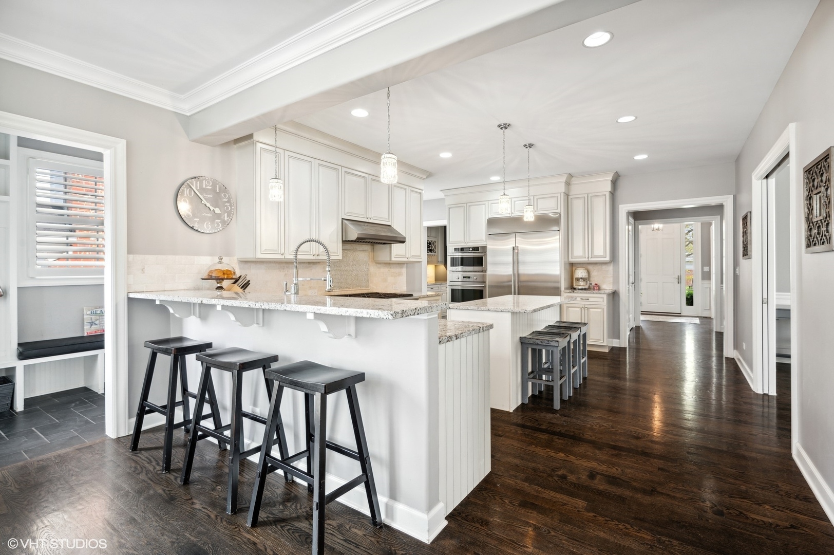 357 Madison Avenue Glencoe, IL 60022 - Photo 11 of 36 a kitchen with stainless steel appliances granite countertop a dining table chairs stove refrigerator and cabinets