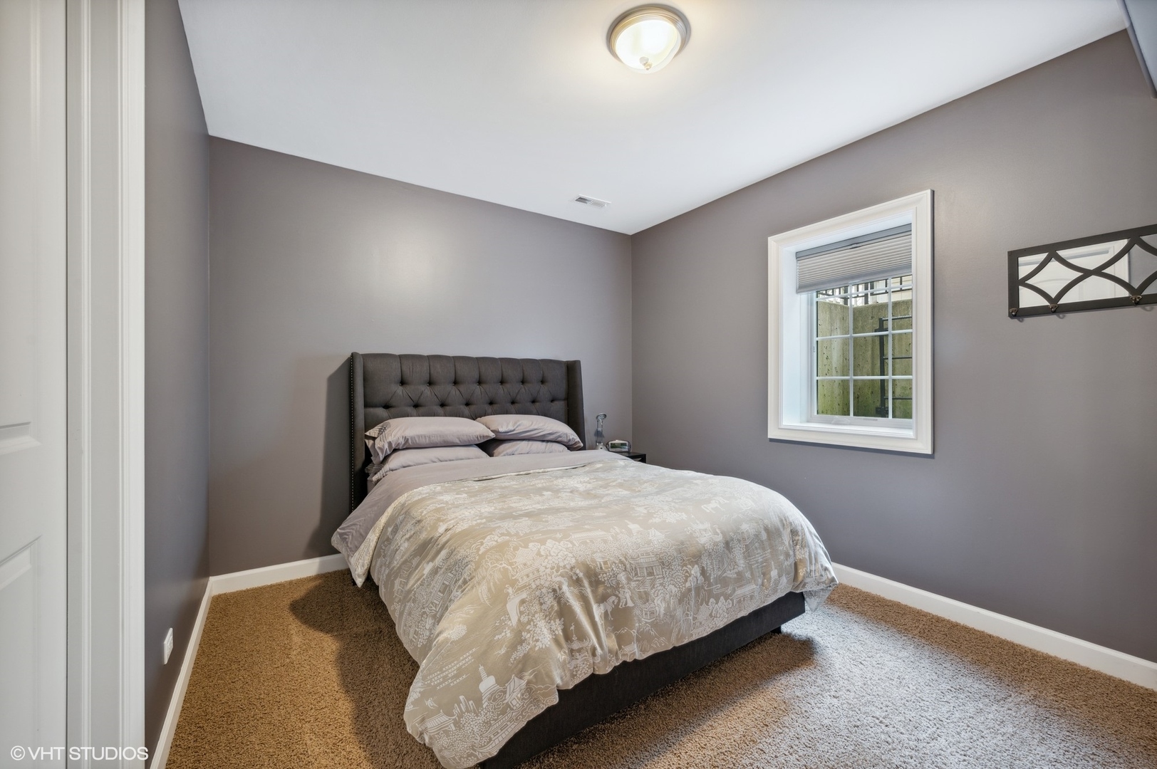 357 Madison Avenue Glencoe, IL 60022 - Photo 32 of 36 a bedroom with a bed and window