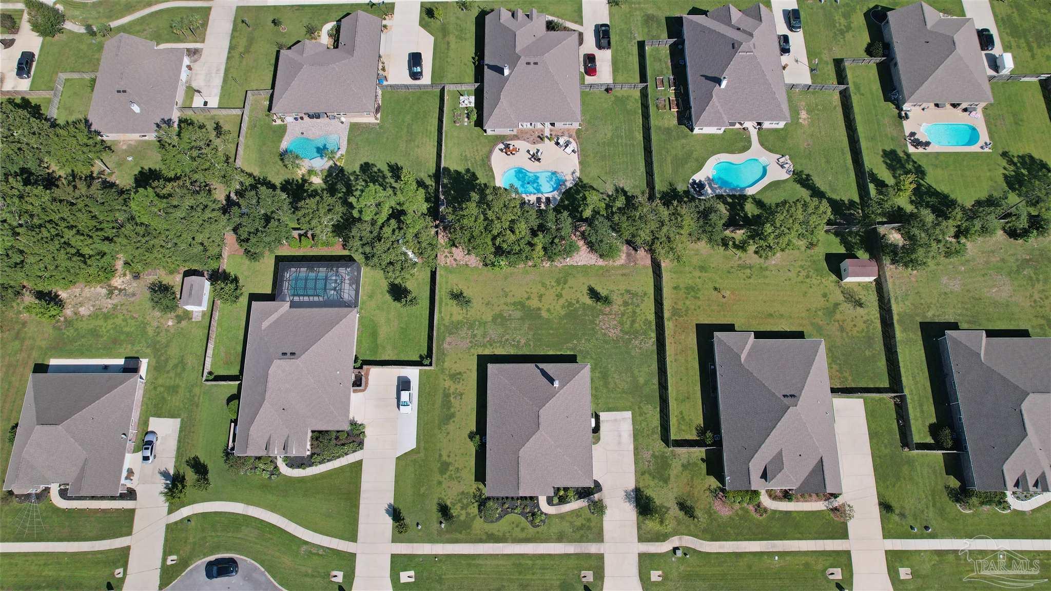 2708 Gemstone Circle Pace, FL 32571 - Photo 32 of 38 an aerial view of multiple houses with yard