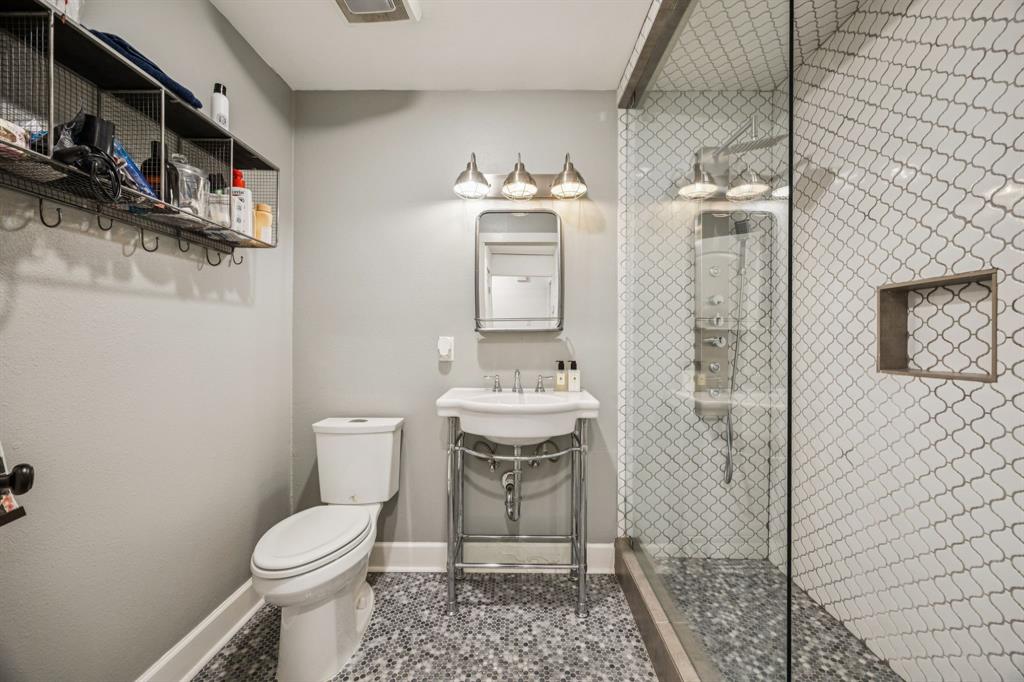 1227 Lansford Avenue Dallas, TX 75224 - Photo 14 of 17 a bathroom with a toilet and a shower