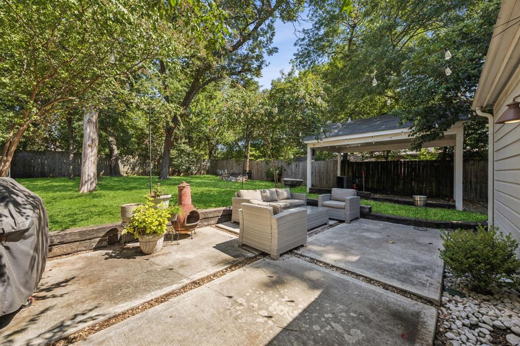 1227 Lansford Avenue Dallas, TX 75224 - Photo 15 of 17 a view of backyard with outdoor seating and green space